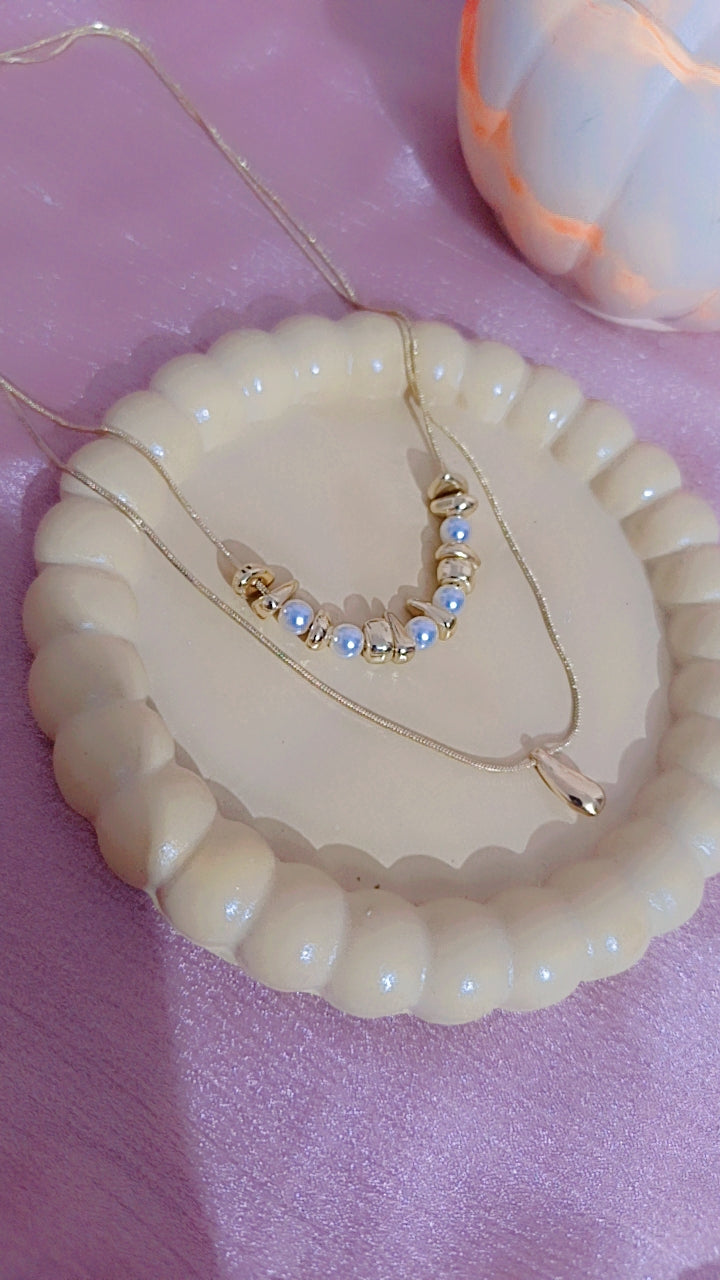 Double Layered Gold Necklace with Pearl and Teardrop Pendant.