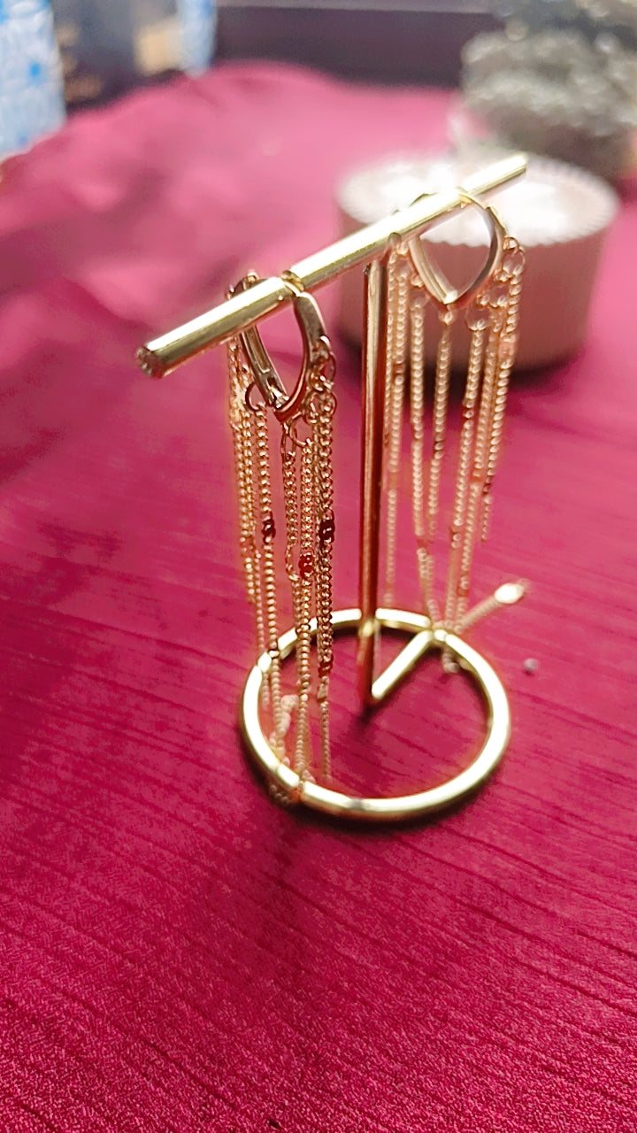 Long gold-toned fringe earring